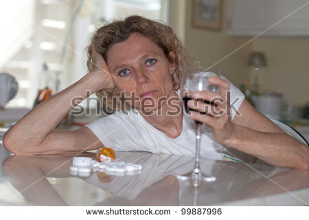 stock-photo-mature-addicted-woman-drinking-wine-and-pills-99887996.jpg