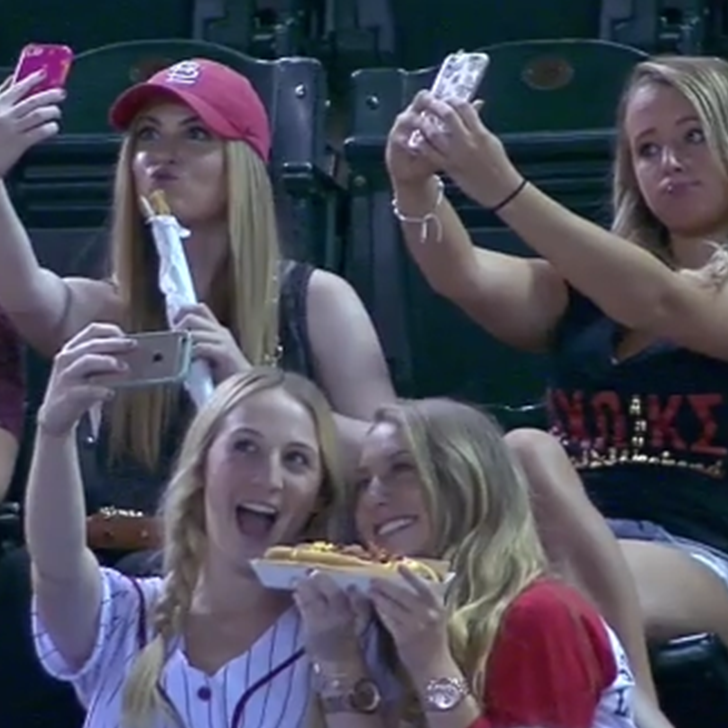 Girls-Take-Selfies-Baseball-Game.png