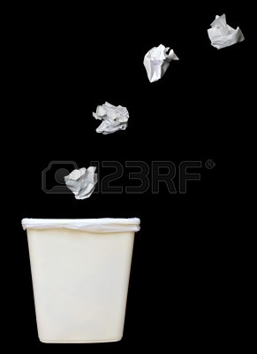 9327828-bunch-of-crumbled-paper-being-throwing-into-a-trash-bin-or-waste-bin-isolated-on-black-background.jpg