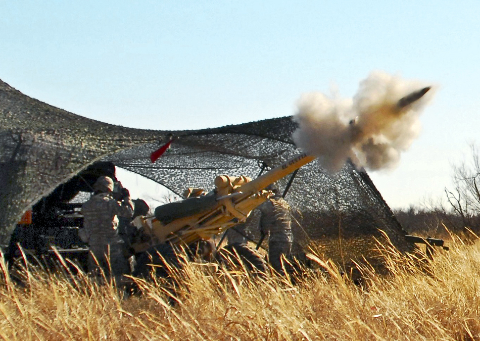 here-it-comes-105-mm-round-M119-Howitzer-02-2011.jpg