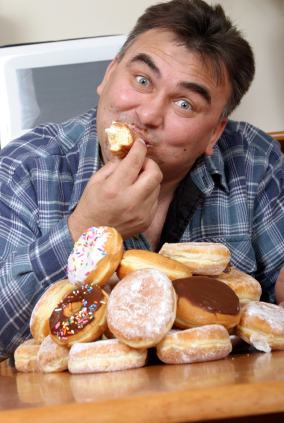 fat_man_eating_doughnuts_photo.jpg