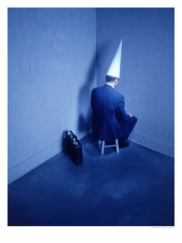 386410abusinessman-sitting-in-corner-with-dunce-hat-posters1_(1).jpg
