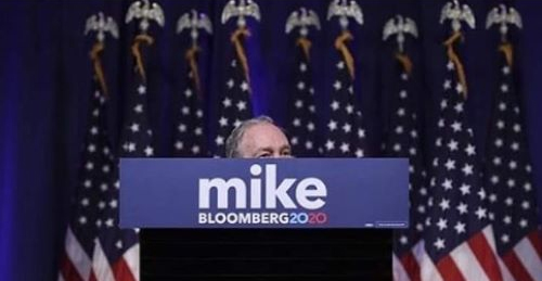 Bloomberg top of head behind podium.jpg