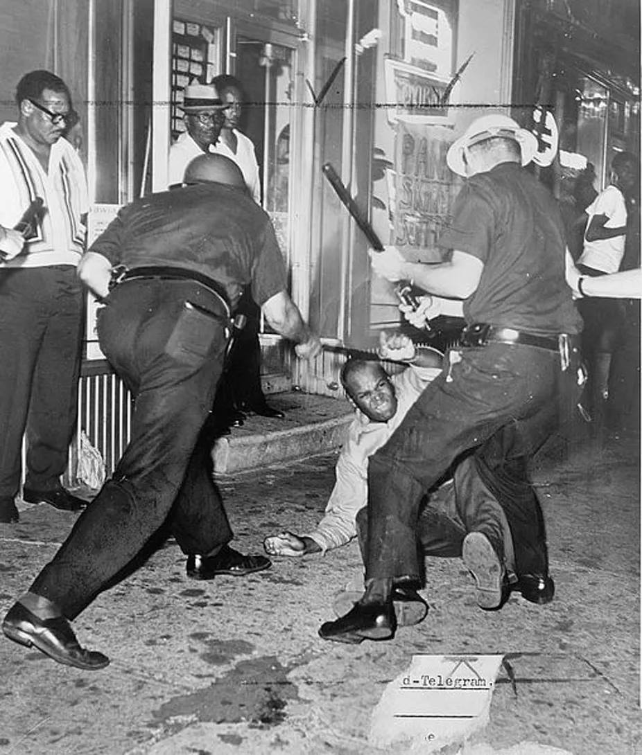 Cops beating a Black man.jpg