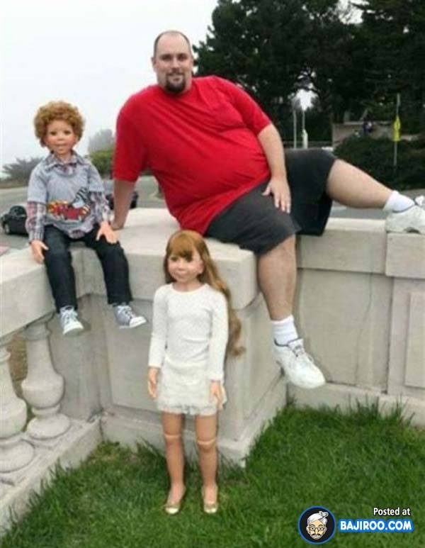 funny-man-with-baby-dolls-pics-images.jpg