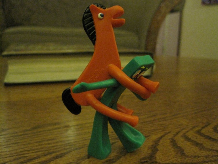 Gumby being ridden by pokey.JPG