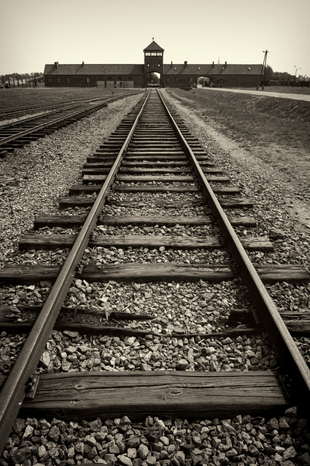 main-gate-railroad-nazi-concentration-camp-auschwitz-birkenau_100655-652.jpg