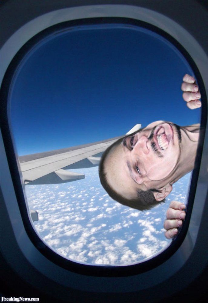 Man-Hanging-on-to-Outside-of-Plane-Window--57112.jpg