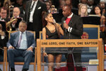 Bishop-Charles-H.-Ellis-III-holding-Ariana-Grande.-Photo-Hugo-GLoss-1728x1152.jpg