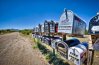8025446-rural-mailboxes-in-a-dirt-street-wide-angle-shot.jpg