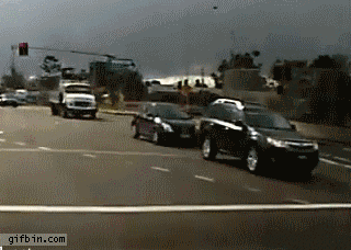 1360259445_truck_almost_crashes_into_cars.gif