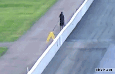 1336405471_drag_race_photographer_almost_hit_by_crashing_car.gif