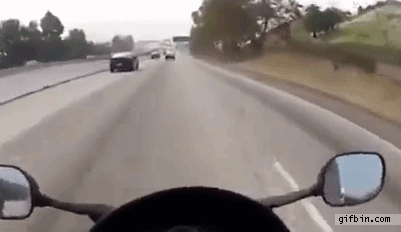 1353522819_lucky_biker_misses_flying_matress_on_highway.gif