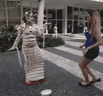 funny-gif-girl-touching-living-statue.gif