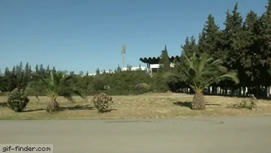 Idiot-Trys-to-Jump-Over-Car.gif