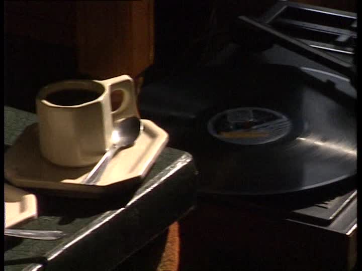 268776752-record-player-record-vinyl-coffee-cup-spoon.jpg