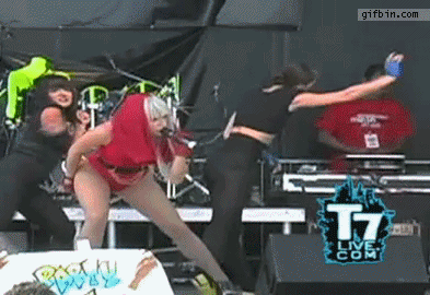 1329331796_lady_gaga_hits_dancer_in_the_face_with_mic.gif