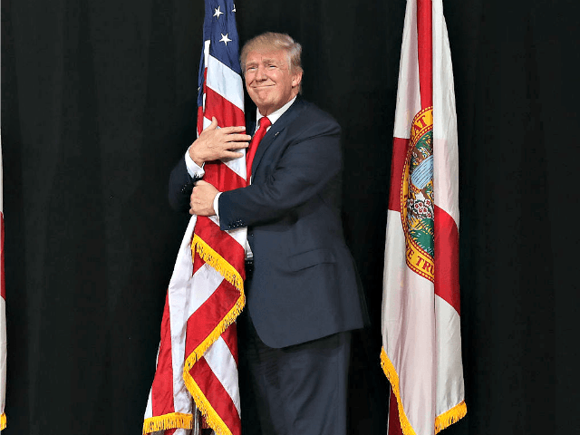 Trump-Hugs-Flag-in-Tampa-Joe-RaedleGetty.png