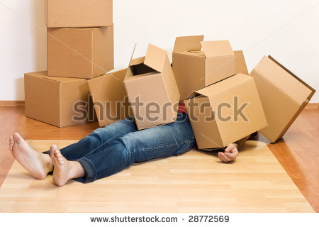stock-photo-man-covered-by-lots-of-cardboard-boxes-moving-concept-28772569.jpg