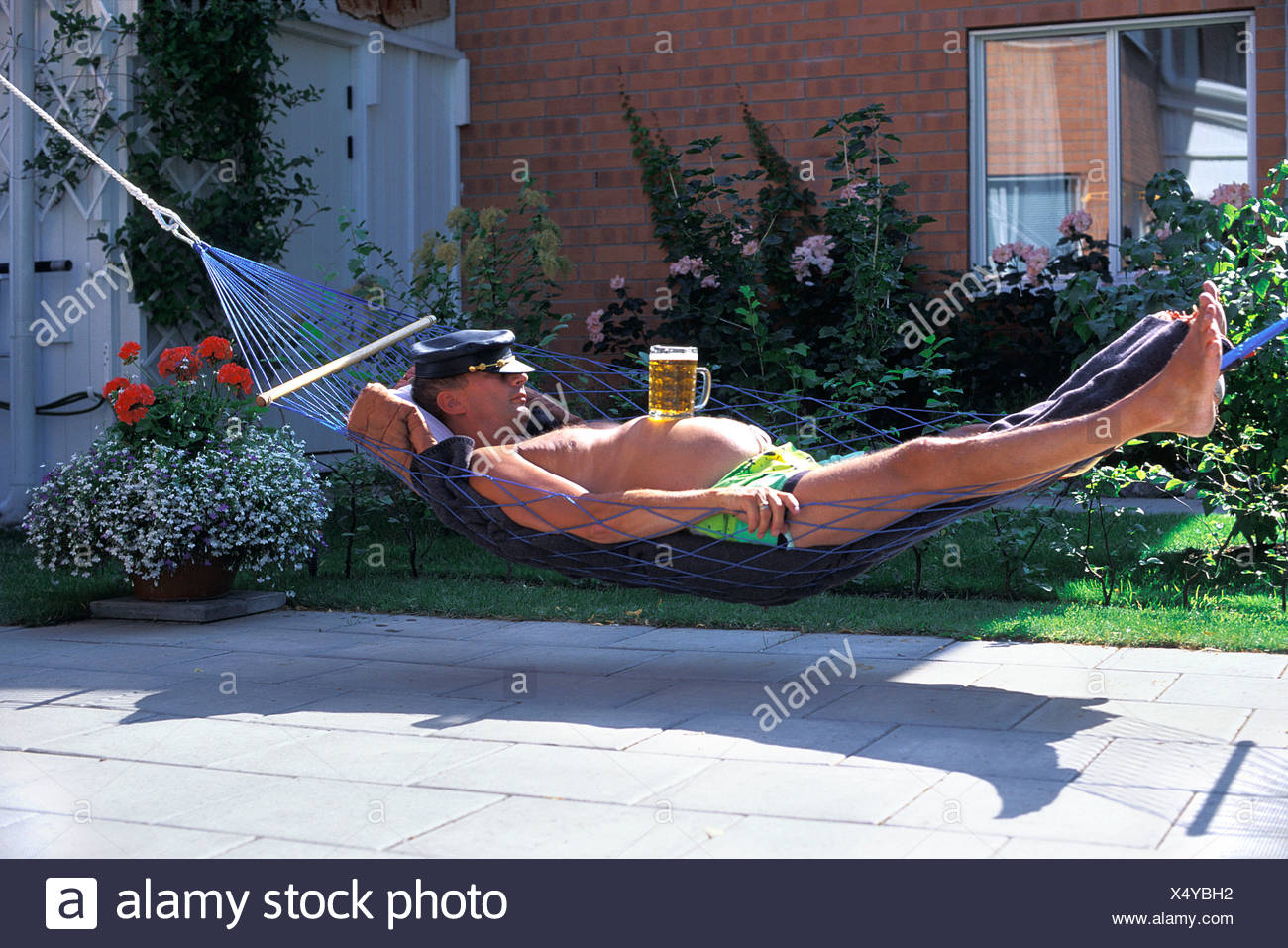 amusing-beer-belly-belly-dozing-garden-hammock-home-house-humor-leather-cap-man-outside-recumbent-lie-X4YBH2.jpg