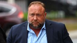 Infowars founder Alex Jones arrives with private security guards to speak to the media after appearing at his Sandy Hook defamation trial at Connecticut Superior Court in Waterbury, Connecticut, U.S., October 4, 2022. REUTERS/Mike Segar