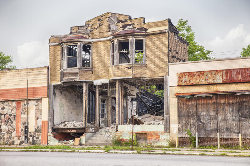 urban-blight-detroit-usa-june-burned-out-semi-demolished-building-two-closed-storefronts-hamilton-avenue-56995954.jpg